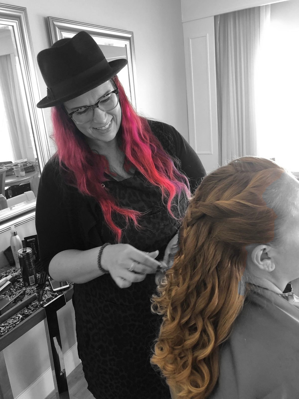 Kristina Merza styling a client's hair at Klassic Beauty Salon in Fort Myers